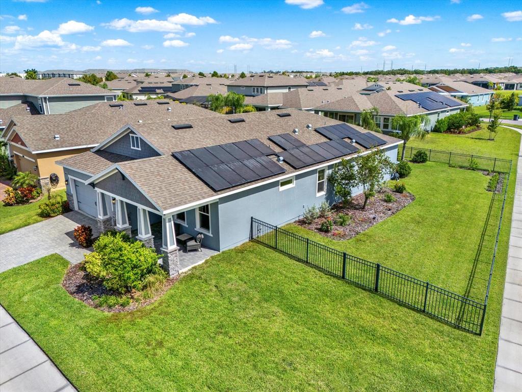 6003 Milestone Drive Apollo Beach, FL 33572 - Photo 2 of 50 an aerial view of a house with a garden and plants