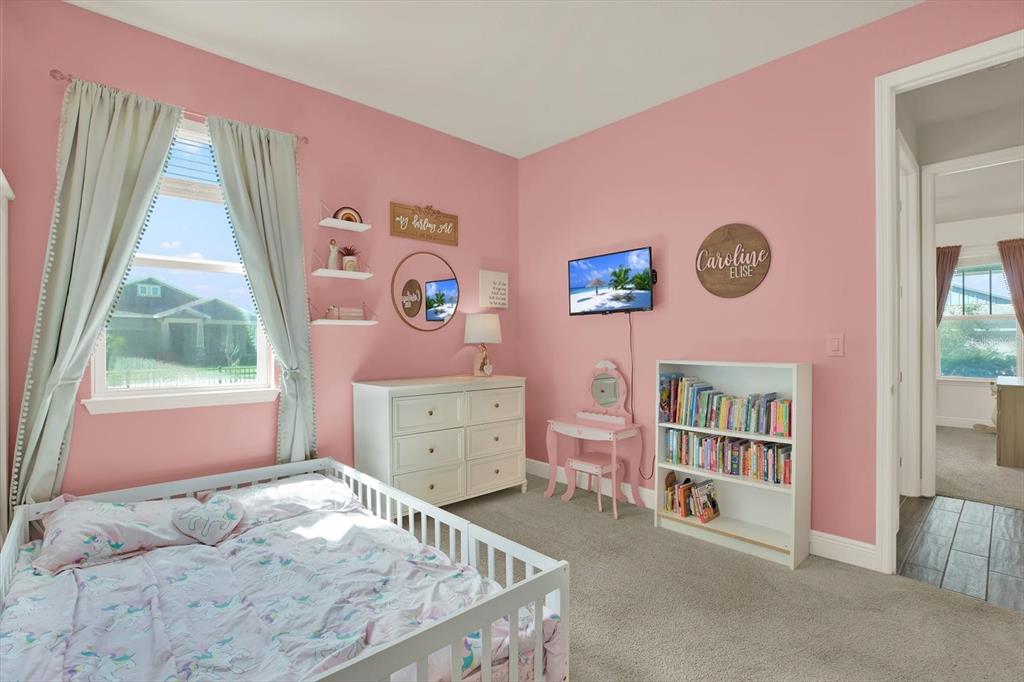 6003 Milestone Drive Apollo Beach, FL 33572 - Photo 21 of 50 a bed room with a bed and a window