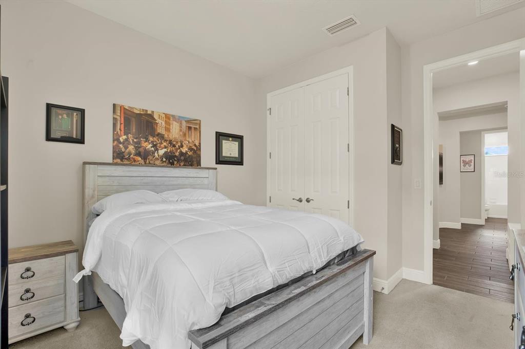 6003 Milestone Drive Apollo Beach, FL 33572 - Photo 24 of 50 a bedroom with a bed and a view of bathroom