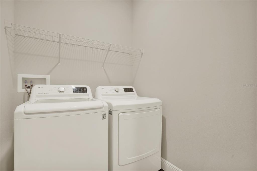 6003 Milestone Drive Apollo Beach, FL 33572 - Photo 28 of 50 a utility room with dryer and washer