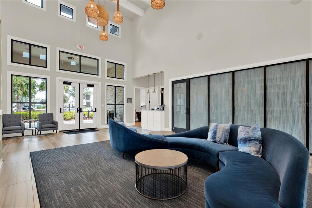 6003 Milestone Drive Apollo Beach, FL 33572 - Photo 36 of 50 a living room with furniture and a floor to ceiling window