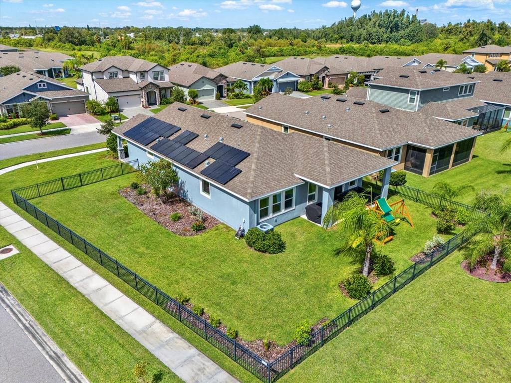 6003 Milestone Drive Apollo Beach, FL 33572 - Photo 4 of 50 an aerial view of a house with a garden