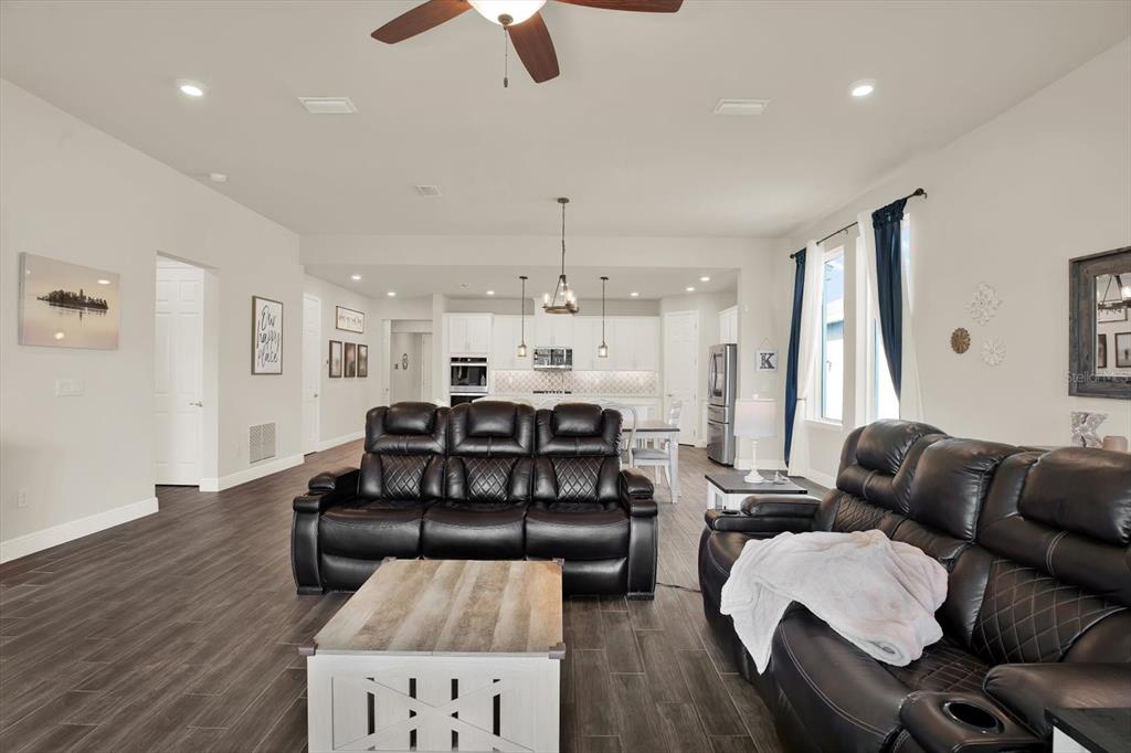 6003 Milestone Drive Apollo Beach, FL 33572 - Photo 8 of 50 a living room with furniture fireplace and wooden floor