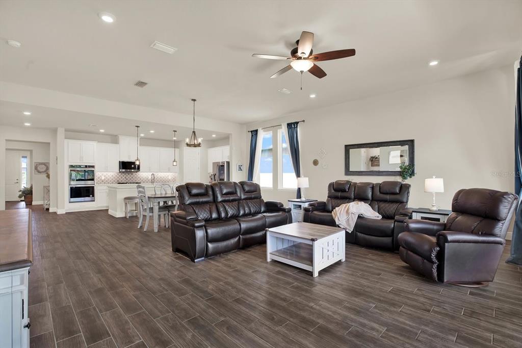 6003 Milestone Drive Apollo Beach, FL 33572 - Photo 9 of 50 a living room with furniture and a view of kitchen