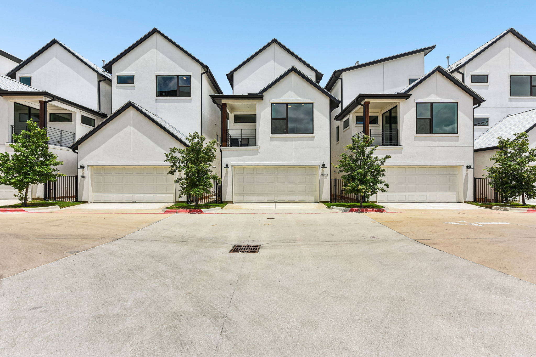 9033 Cattle Baron Path Austin, TX 78747 - Photo 40 of 40 Clean lines and modern design define these striking townhomes, each with an integrated garage.