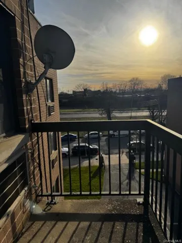 a view of a balcony with a potted plant