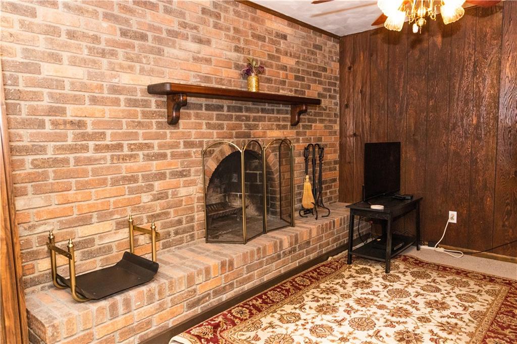 11322 McKee Road North Huntingdon, PA 15642 - Photo 16 of 25 Gameroom features a wood burning fireplace.