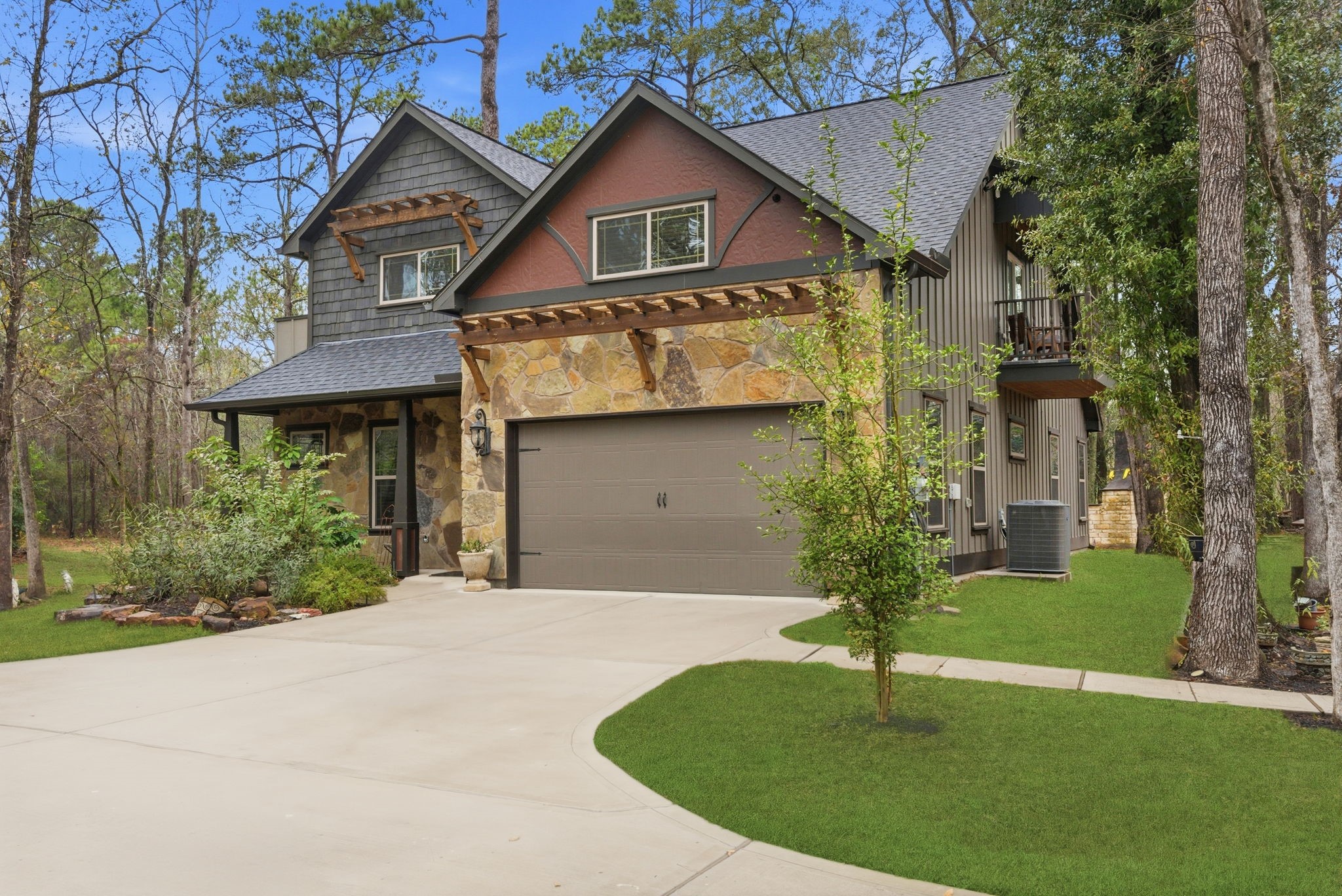 1480 Traylor Road Conroe, TX 77304 - Photo 4 of 25 a front view of a house with a yard and garage