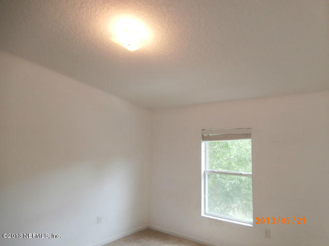 7920 Merrill Road, Unit 310 Jacksonville, FL 32277 - Photo 4 of 7 an empty room with a window