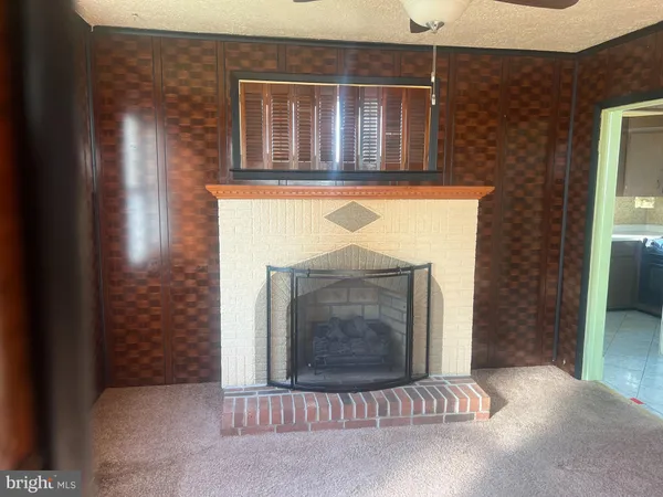 a view of fireplace and window