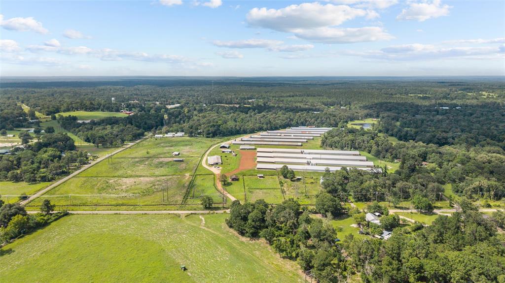 3216 Old Ewing Road Lufkin, TX 75901 - Photo 2 of 24 Expansive agricultural property featuring multiple pou, extensive open land, and perimeter fencing
