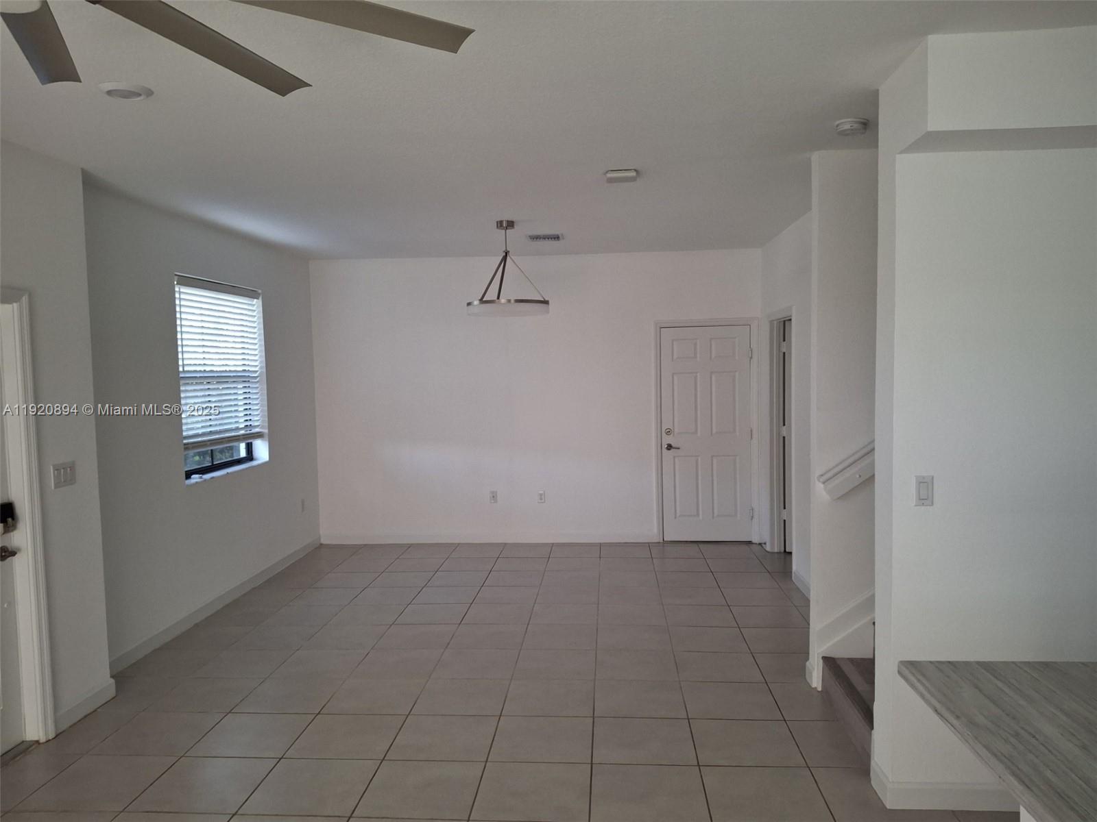 5896 Mustang Manor Davie, FL 33314 - Photo 11 of 14 a view of an empty room with a window