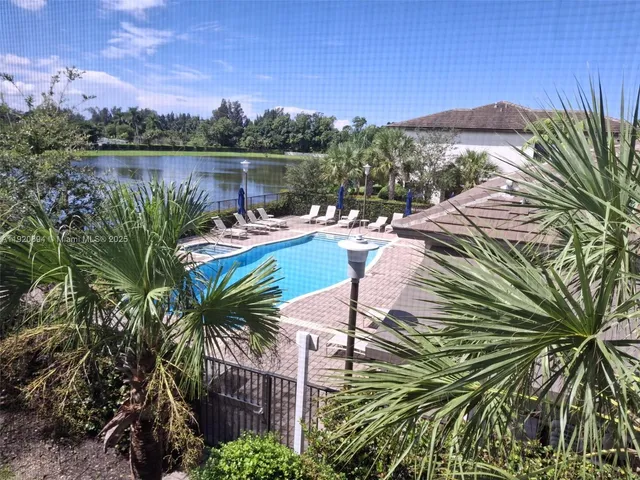 a view of a lake with a yard