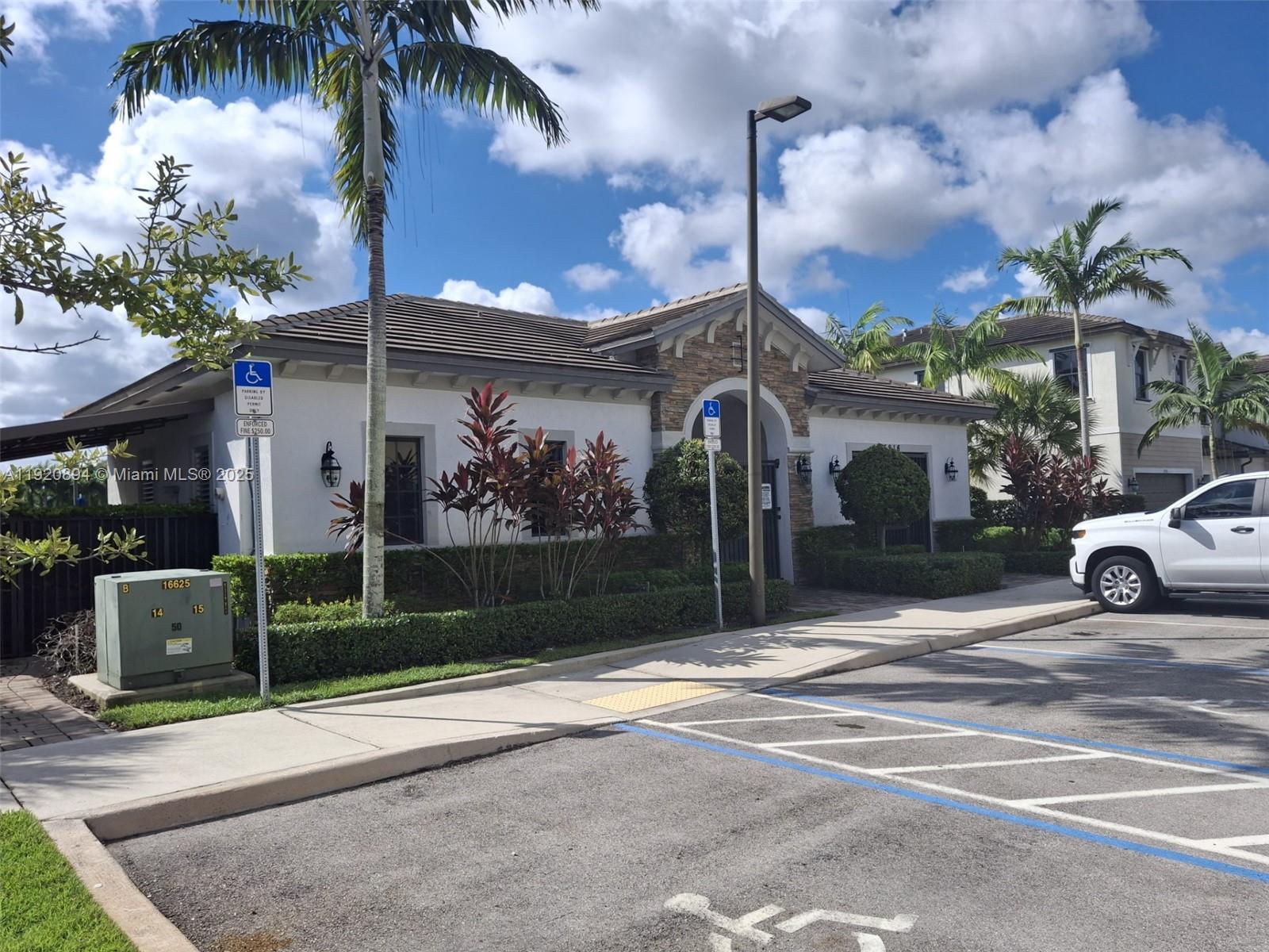 5896 Mustang Manor Davie, FL 33314 - Photo 7 of 14 a view of a street with a cars parked in front of it