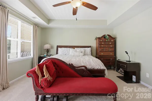a bedroom with a bed and a desk