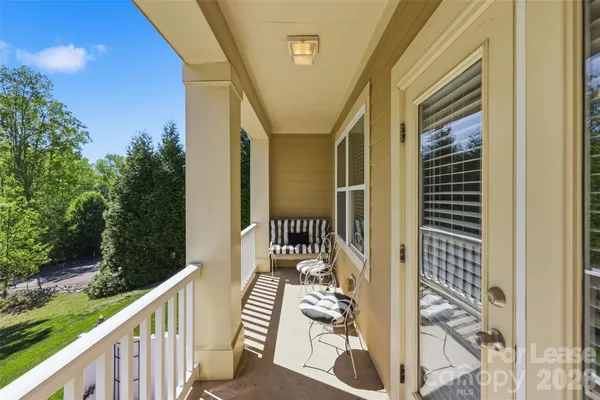 a balcony with wooden floor