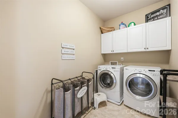 a view of a storage & utility room with washer and dryer
