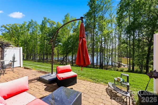 a view of a backyard with sitting area and furniture