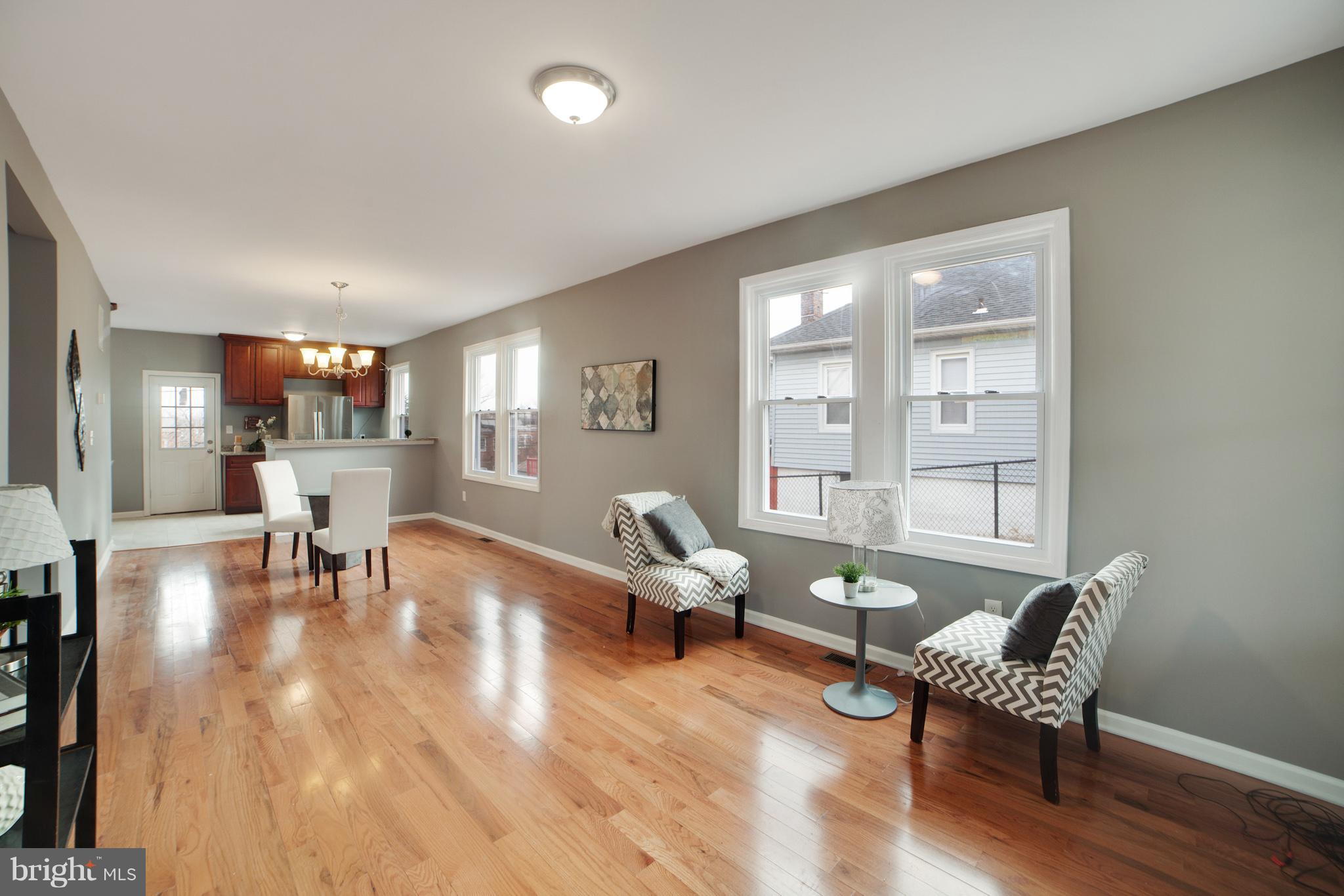 114 West Edgevale Road Baltimore, MD 21225 - Photo 5 of 22 a living room with furniture and wooden floor