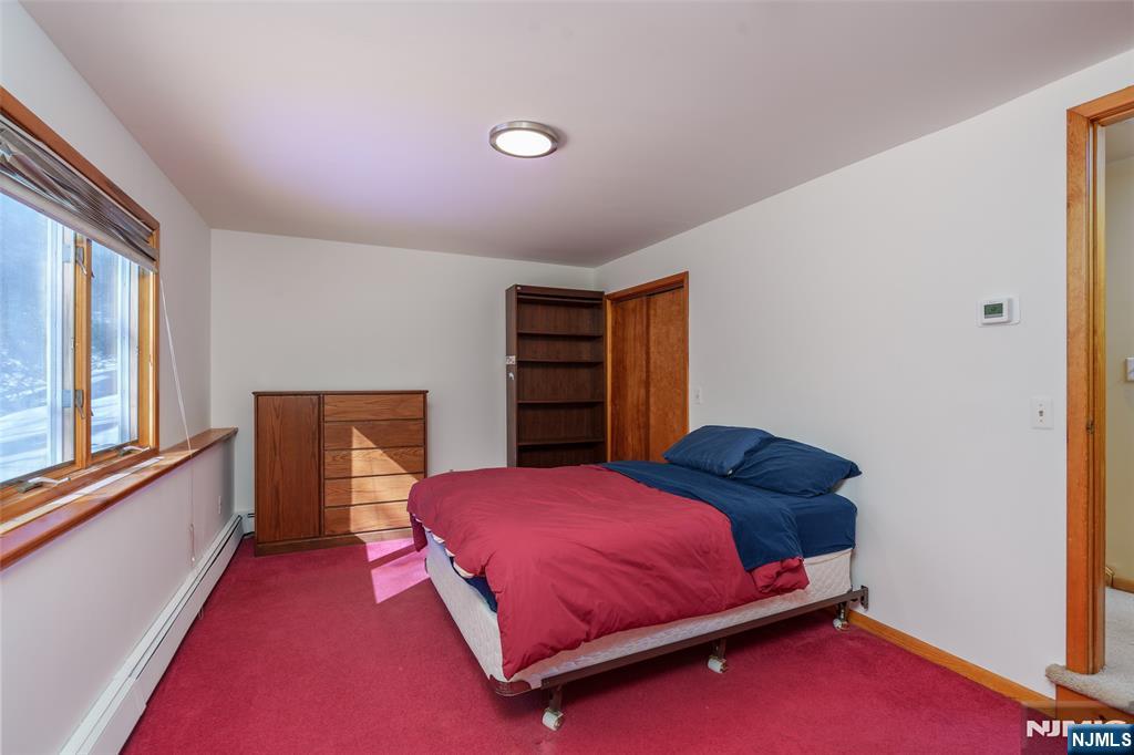 12 Ledgewood Terrace Butler, NJ 07405 - Photo 21 of 34 a bedroom with a bed and a window