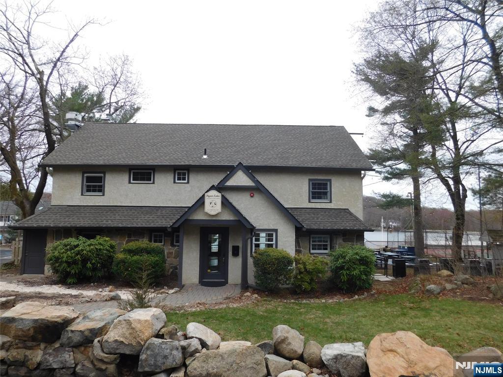 12 Ledgewood Terrace Butler, NJ 07405 - Photo 26 of 34 a front view of a house with garden
