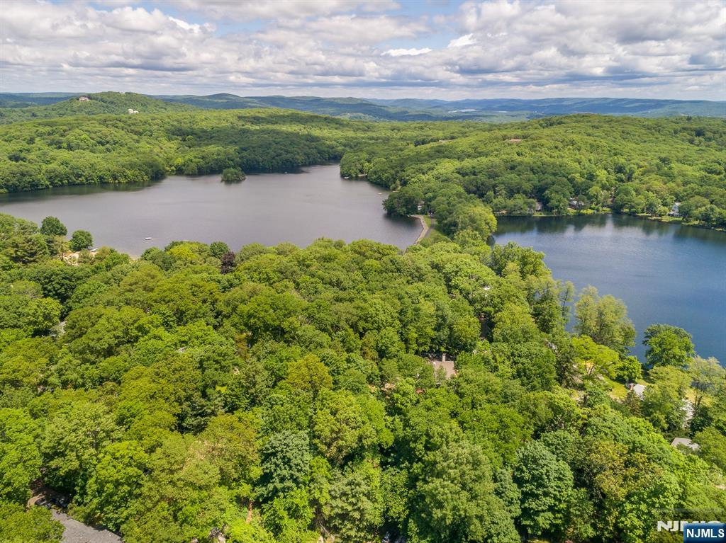12 Ledgewood Terrace Butler, NJ 07405 - Photo 33 of 34 a view of a lake with a building in the background