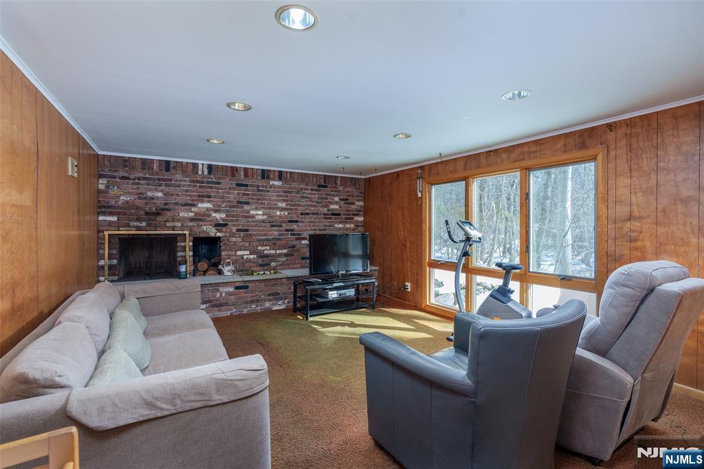 12 Ledgewood Terrace Butler, NJ 07405 - Photo 7 of 34 a living room with fireplace furniture and a large window