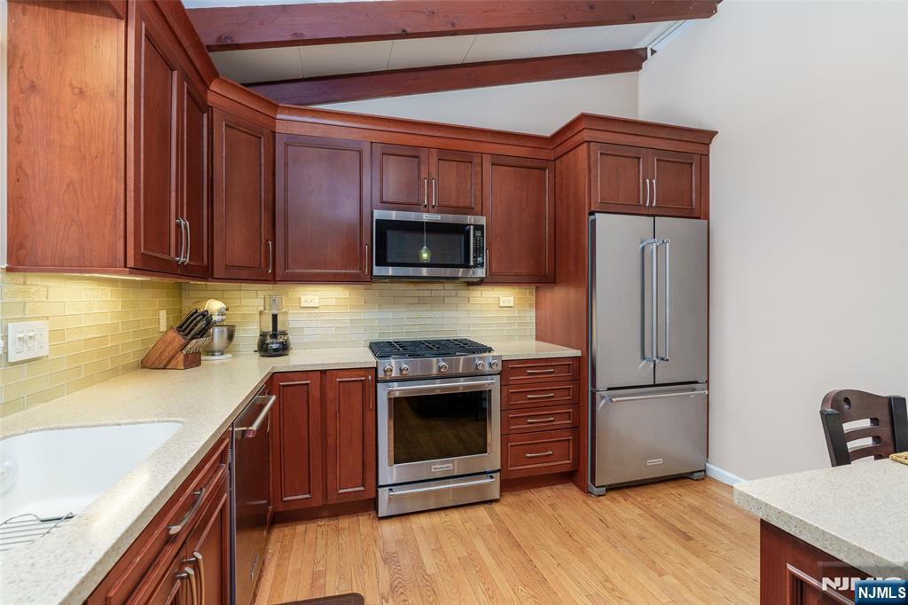 12 Ledgewood Terrace Butler, NJ 07405 - Photo 10 of 34 a kitchen with stainless steel appliances granite countertop a refrigerator stove and sink