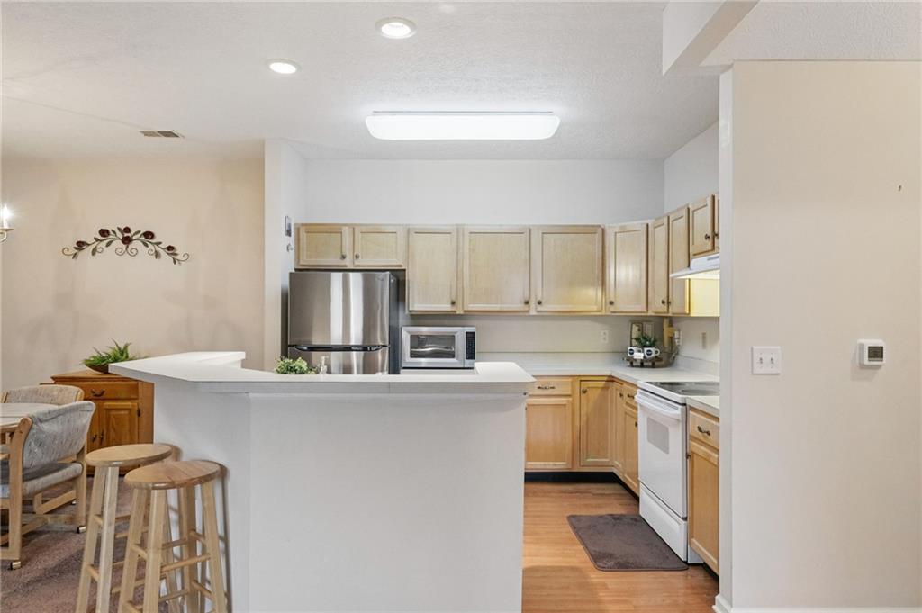 850 Hidden Ridge Court, Unit 101 South Park, PA 15129 - Photo 13 of 38 a kitchen with stainless steel appliances a sink and a refrigerator