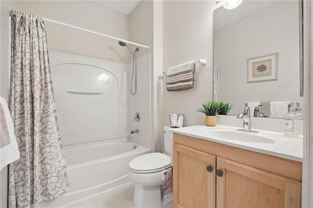 850 Hidden Ridge Court, Unit 101 South Park, PA 15129 - Photo 22 of 38 a bathroom with a sink a toilet and shower