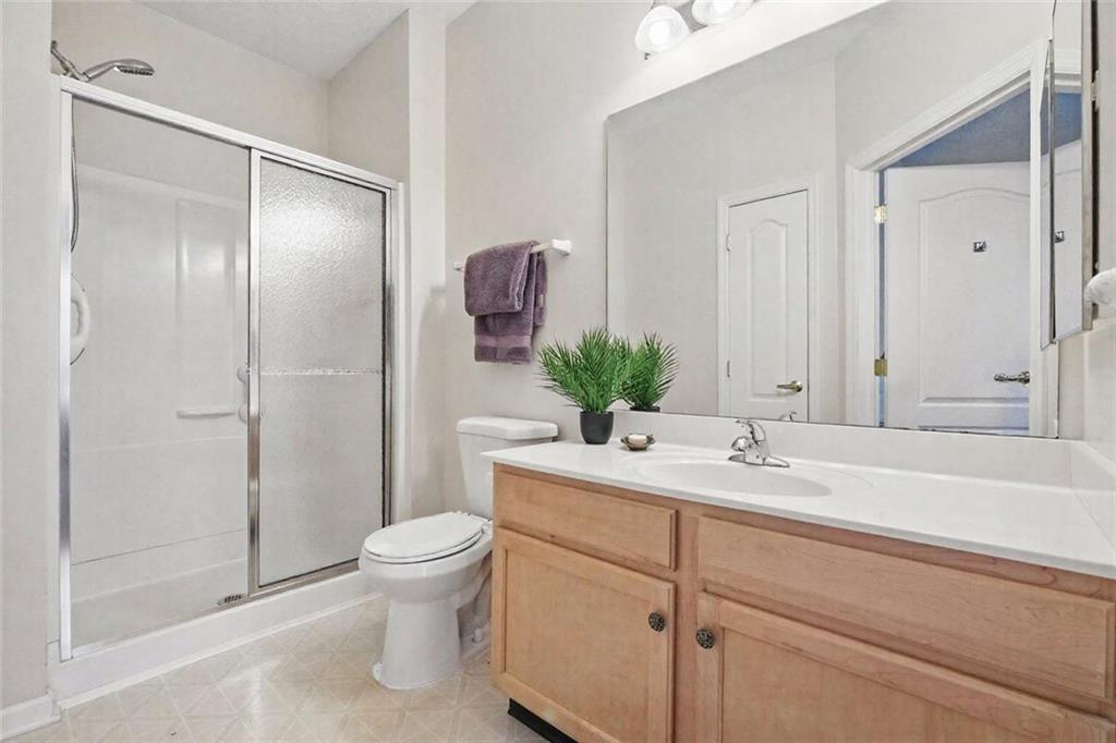 850 Hidden Ridge Court, Unit 101 South Park, PA 15129 - Photo 24 of 38 a bathroom with a sink a toilet and shower