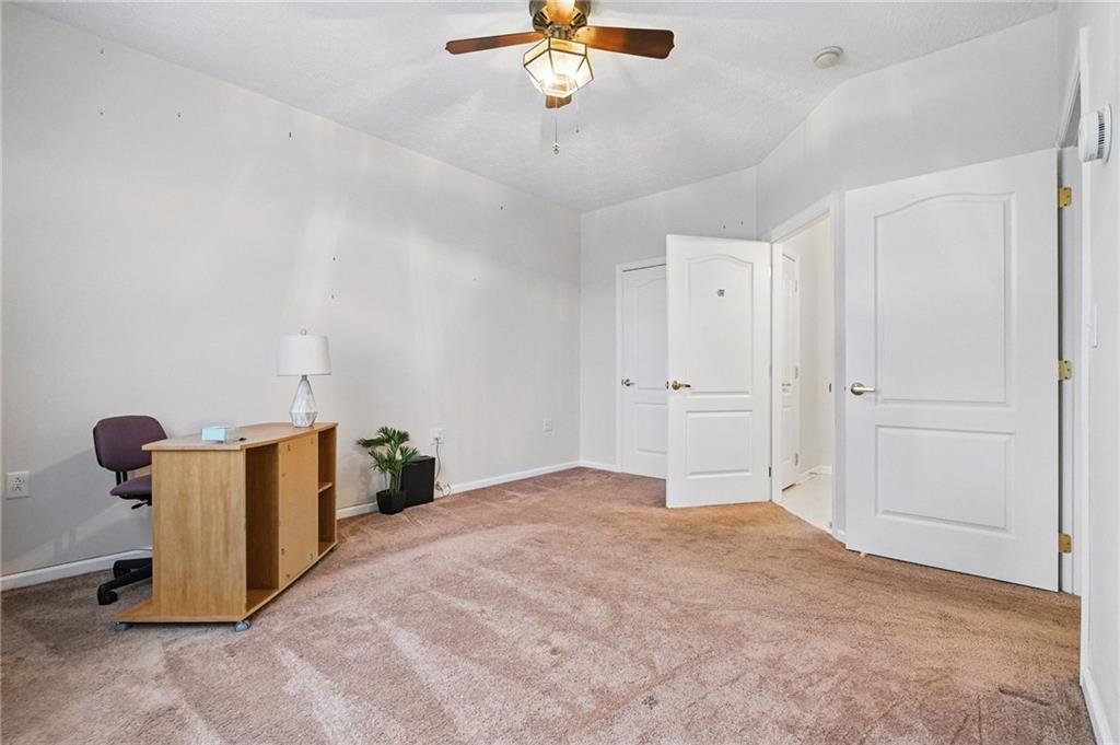 850 Hidden Ridge Court, Unit 101 South Park, PA 15129 - Photo 25 of 38 a view of a room with ceiling fan and window