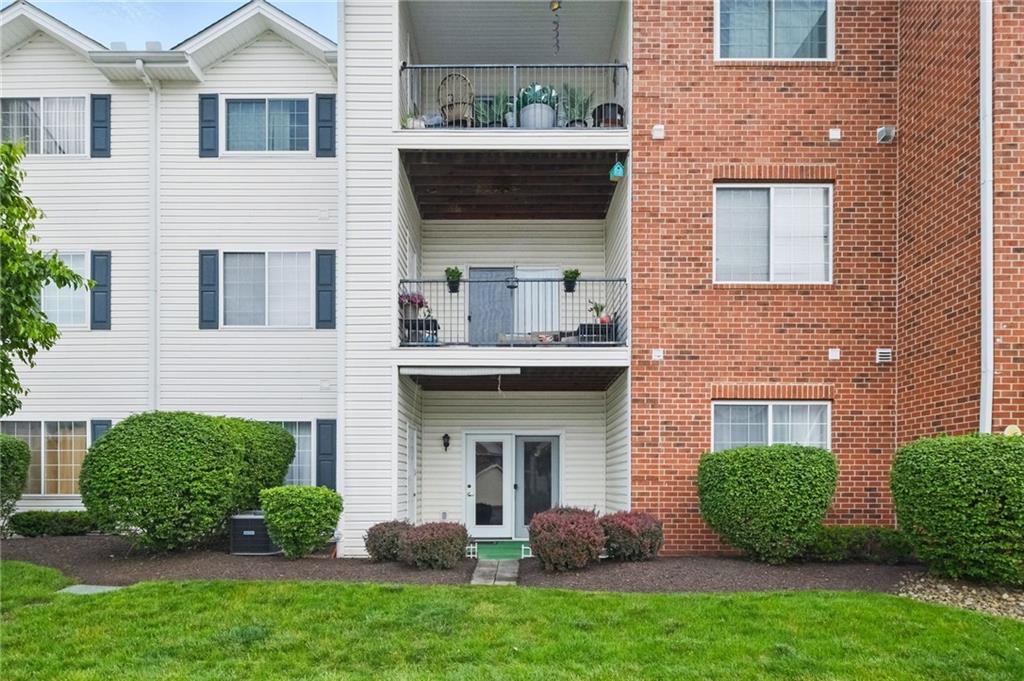 850 Hidden Ridge Court, Unit 101 South Park, PA 15129 - Photo 29 of 38 a view of a house with a yard