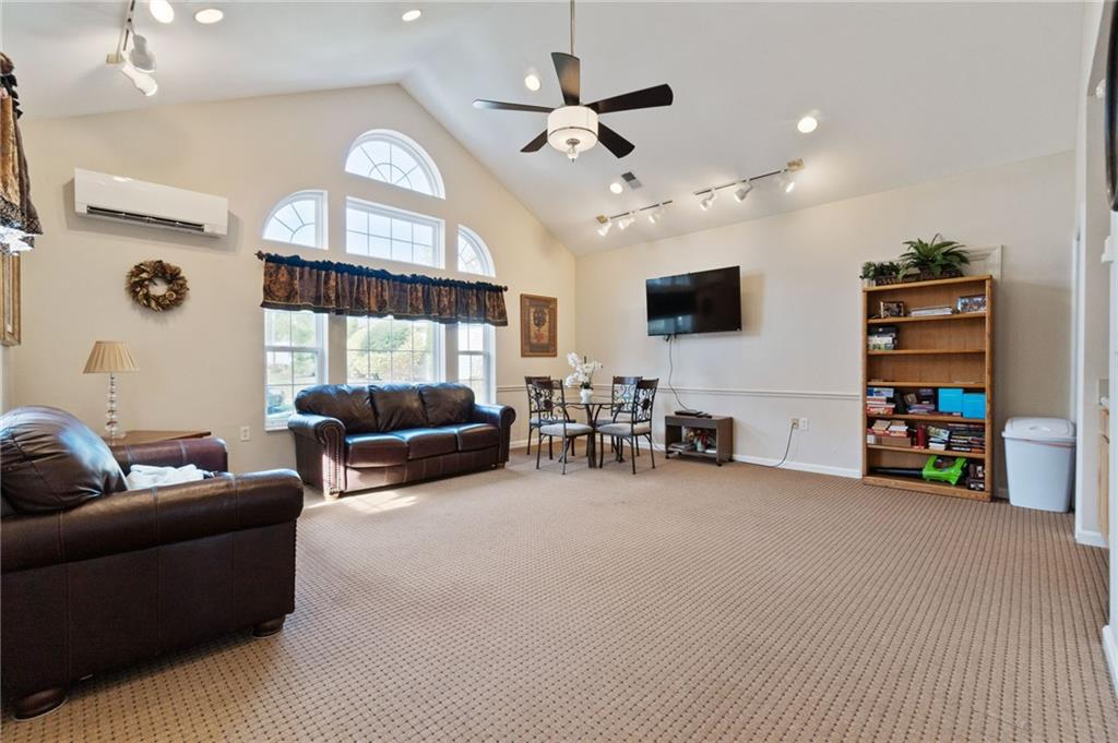 850 Hidden Ridge Court, Unit 101 South Park, PA 15129 - Photo 34 of 38 a living room with furniture and a flat screen tv