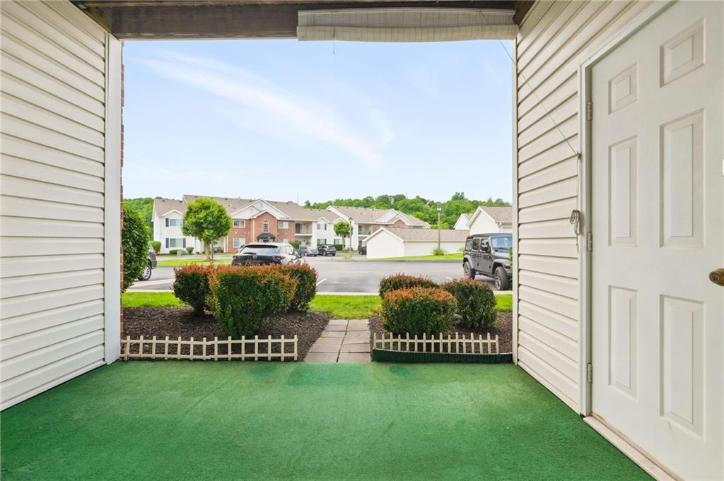 850 Hidden Ridge Court, Unit 101 South Park, PA 15129 - Photo 36 of 38 a view of a porch with chairs and garden