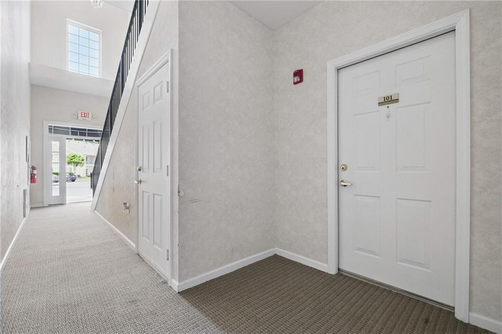 850 Hidden Ridge Court, Unit 101 South Park, PA 15129 - Photo 4 of 38 a view of a hallway with wooden floor and entryway