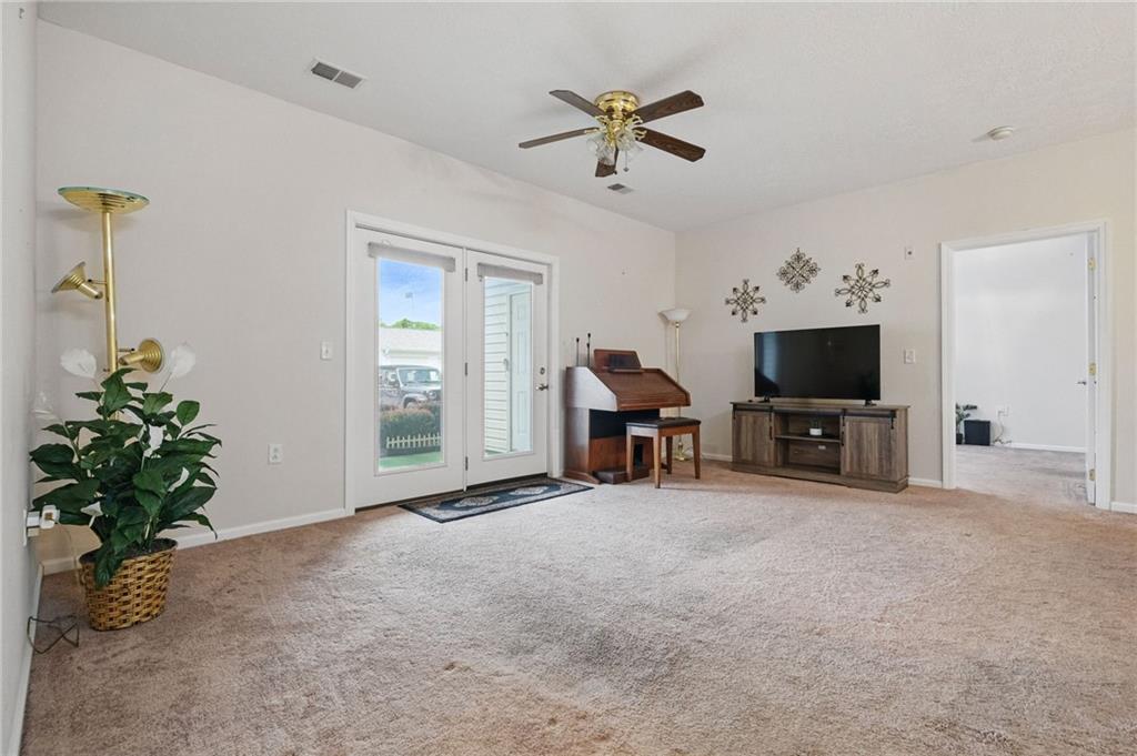 850 Hidden Ridge Court, Unit 101 South Park, PA 15129 - Photo 8 of 38 a living room with furniture and a flat screen tv