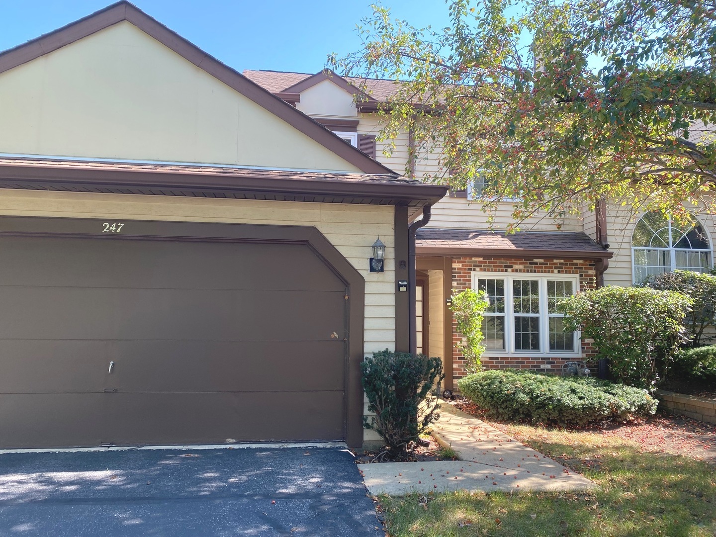 247 Ascot Lane Streamwood, IL 60107 - Photo 1 of 21 a front view of a house with a yard