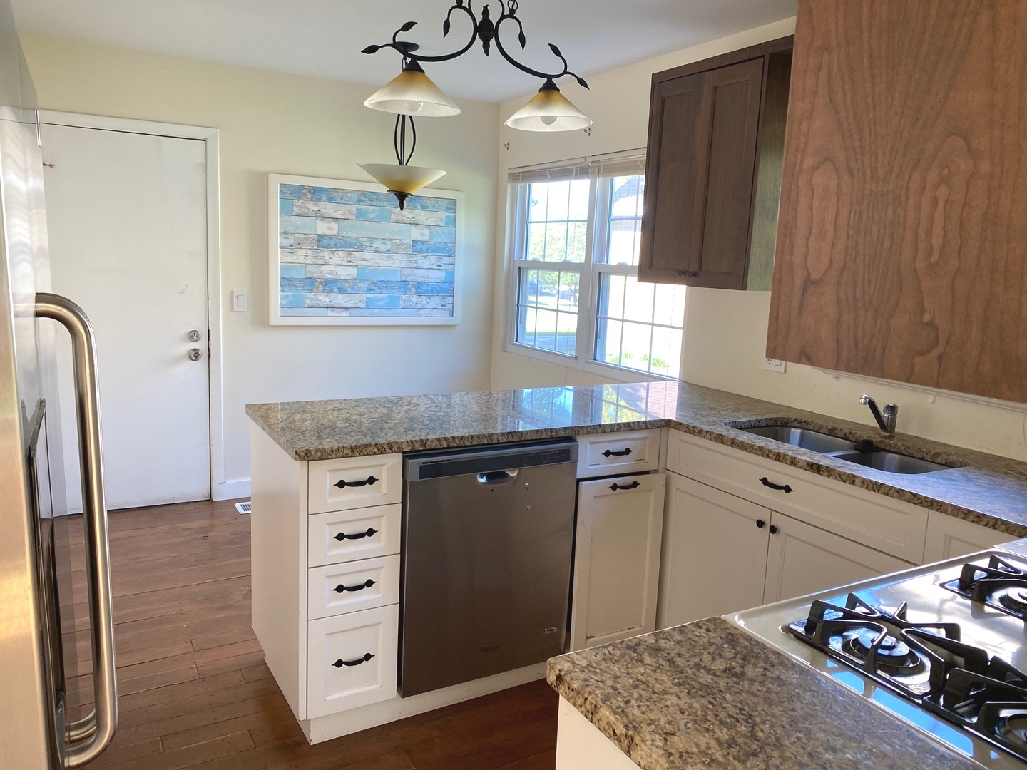 247 Ascot Lane Streamwood, IL 60107 - Photo 2 of 21 a kitchen with stainless steel appliances granite countertop a sink stove and refrigerator