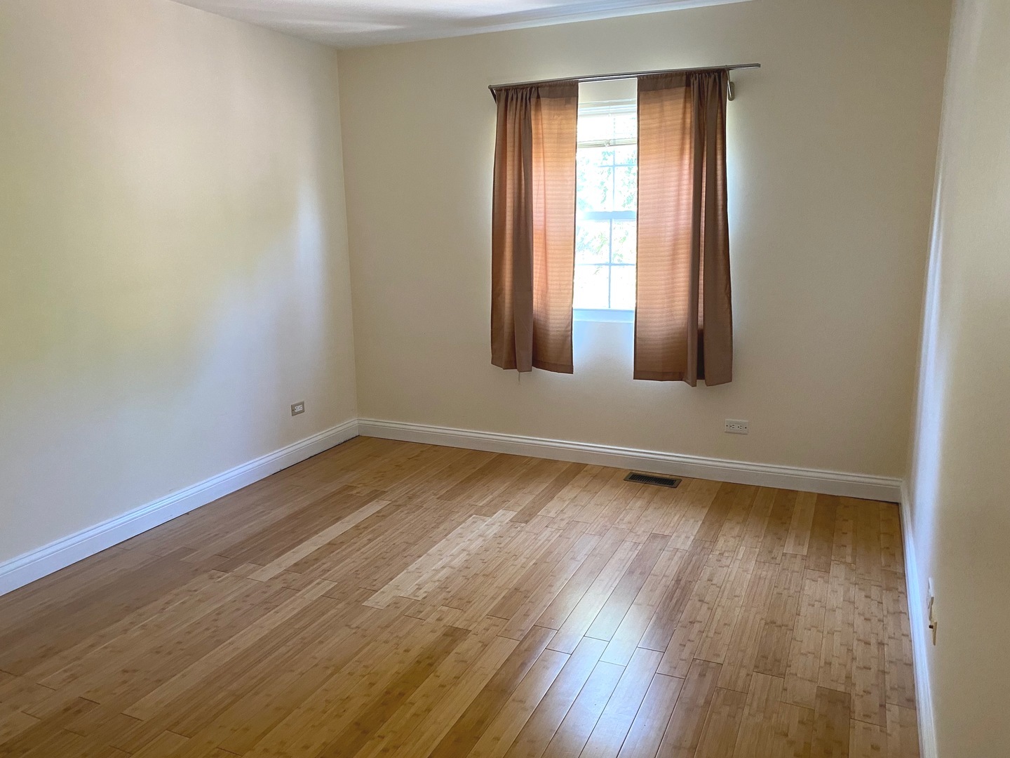247 Ascot Lane Streamwood, IL 60107 - Photo 15 of 21 an empty room with wooden floor and windows