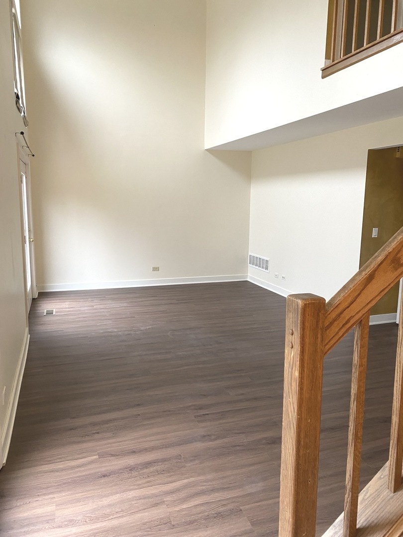 247 Ascot Lane Streamwood, IL 60107 - Photo 6 of 21 a view of hallway with wooden floor