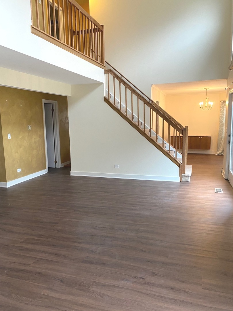 247 Ascot Lane Streamwood, IL 60107 - Photo 7 of 21 a view of staircase with white walls and windows