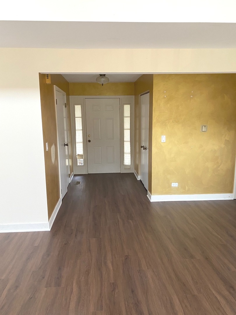 247 Ascot Lane Streamwood, IL 60107 - Photo 9 of 21 a view of a room with wooden floor