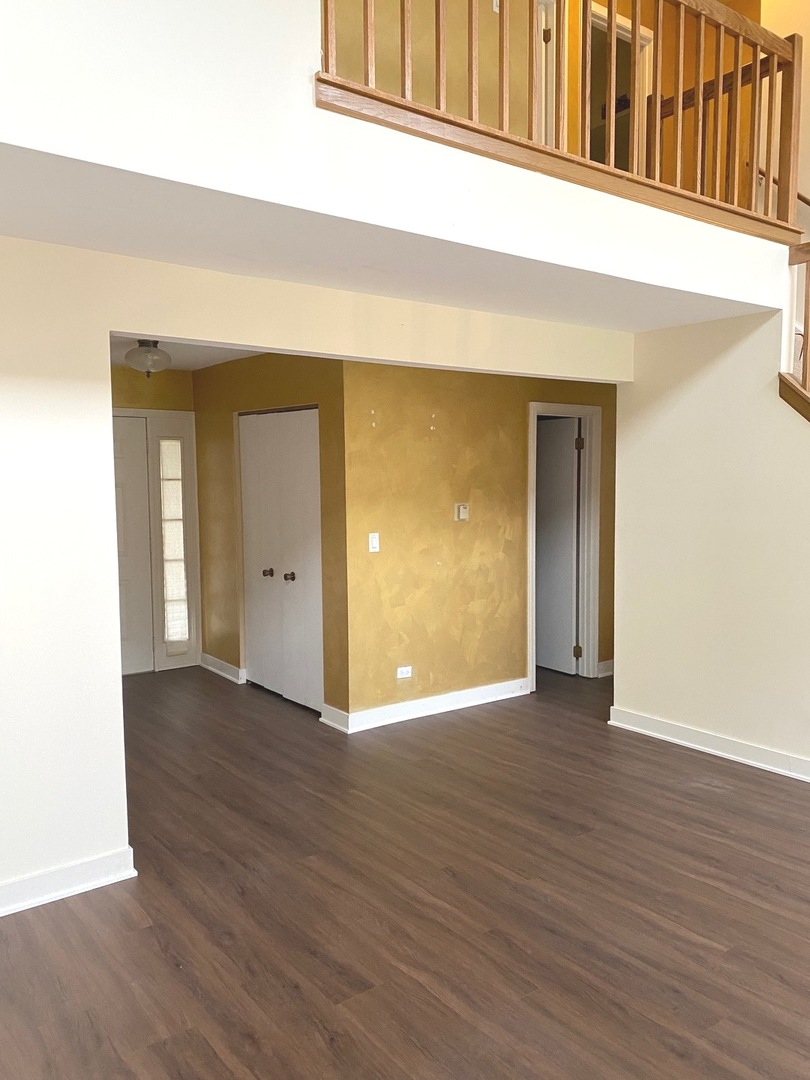 247 Ascot Lane Streamwood, IL 60107 - Photo 10 of 21 a view of an empty room with wooden floor