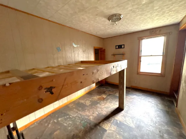 a view of a kitchen with a sink and a window