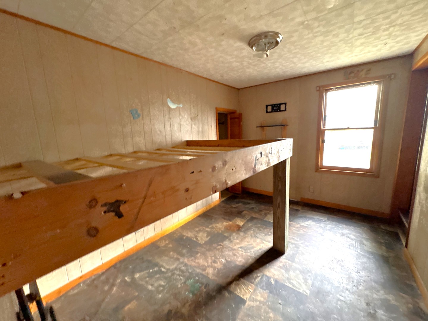 1221 June Street Kewanee, IL 61443 - Photo 5 of 7 a view of a kitchen with a sink and a window