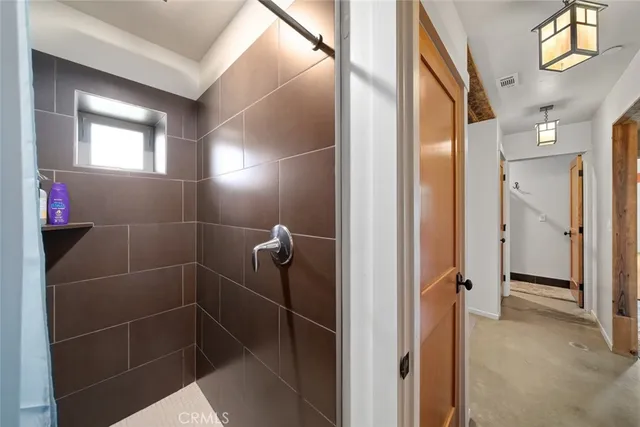 a living room with furniture and a dining table