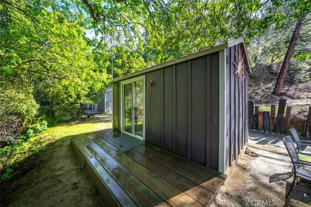 an aerial view of a house with a yard and lake view