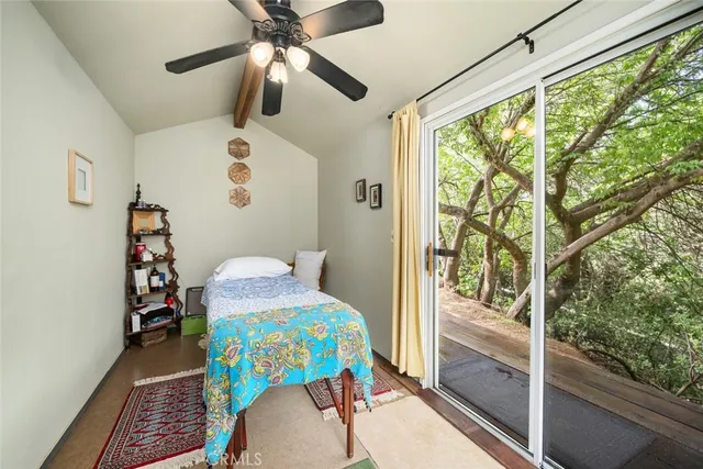 a view of a lake with beach and green space