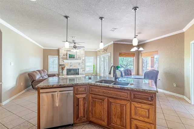 a dining room filled with furniture and a chandelier